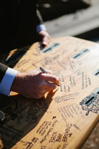 Surfrider Foundation Advocacy Signing Surf Board