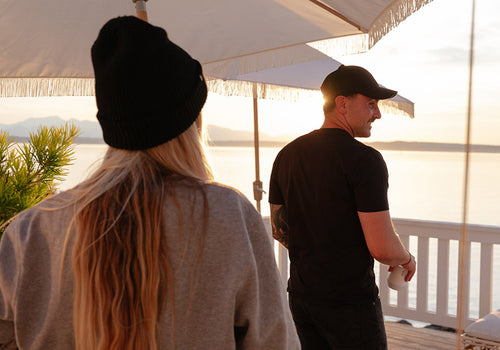 A couple wearing MiiR Apparel on a patio apparel-banner-2-mobile.jpg__PID:d18c84b1-fca8-4e34-8c92-519201705914