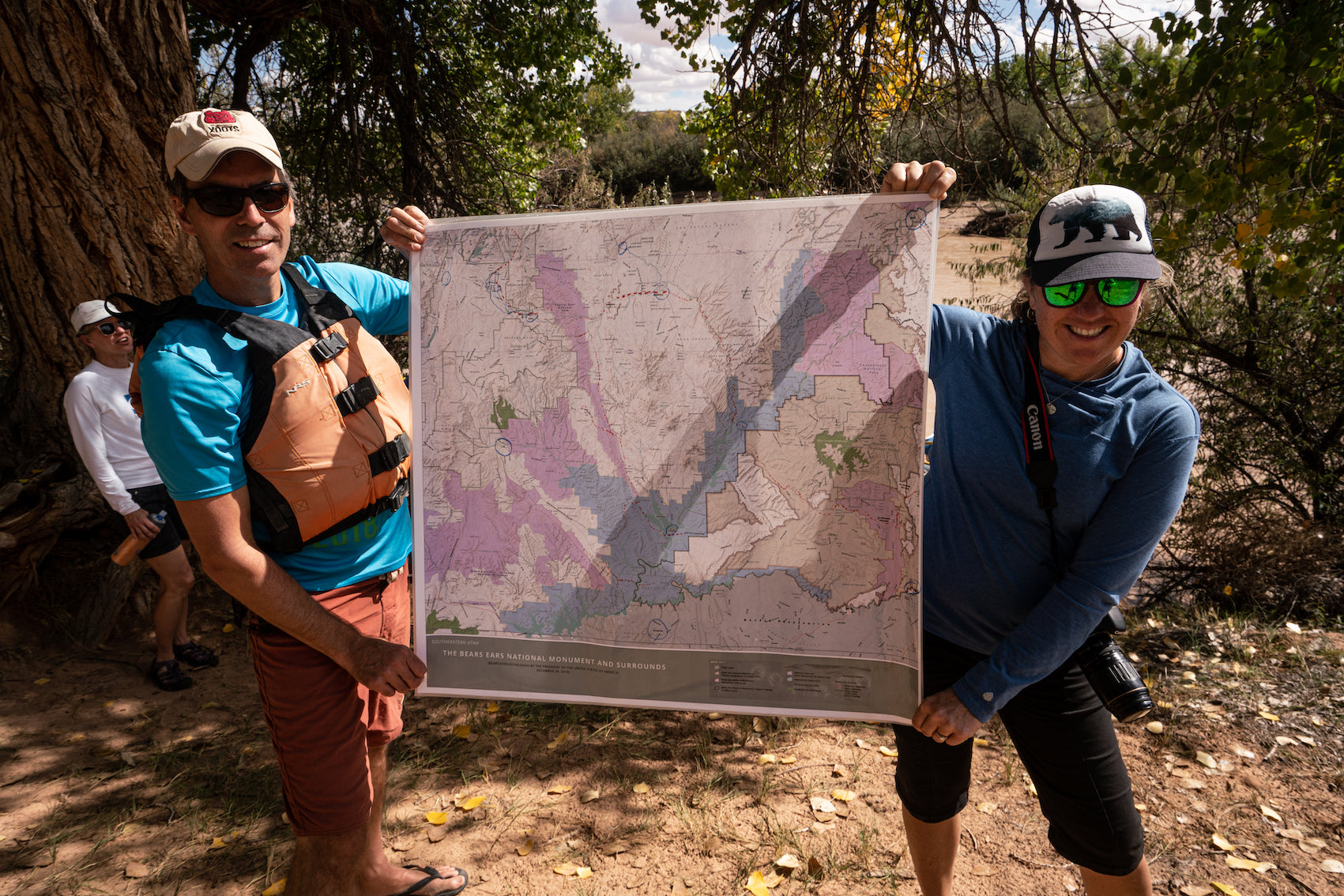 People holding a map of area