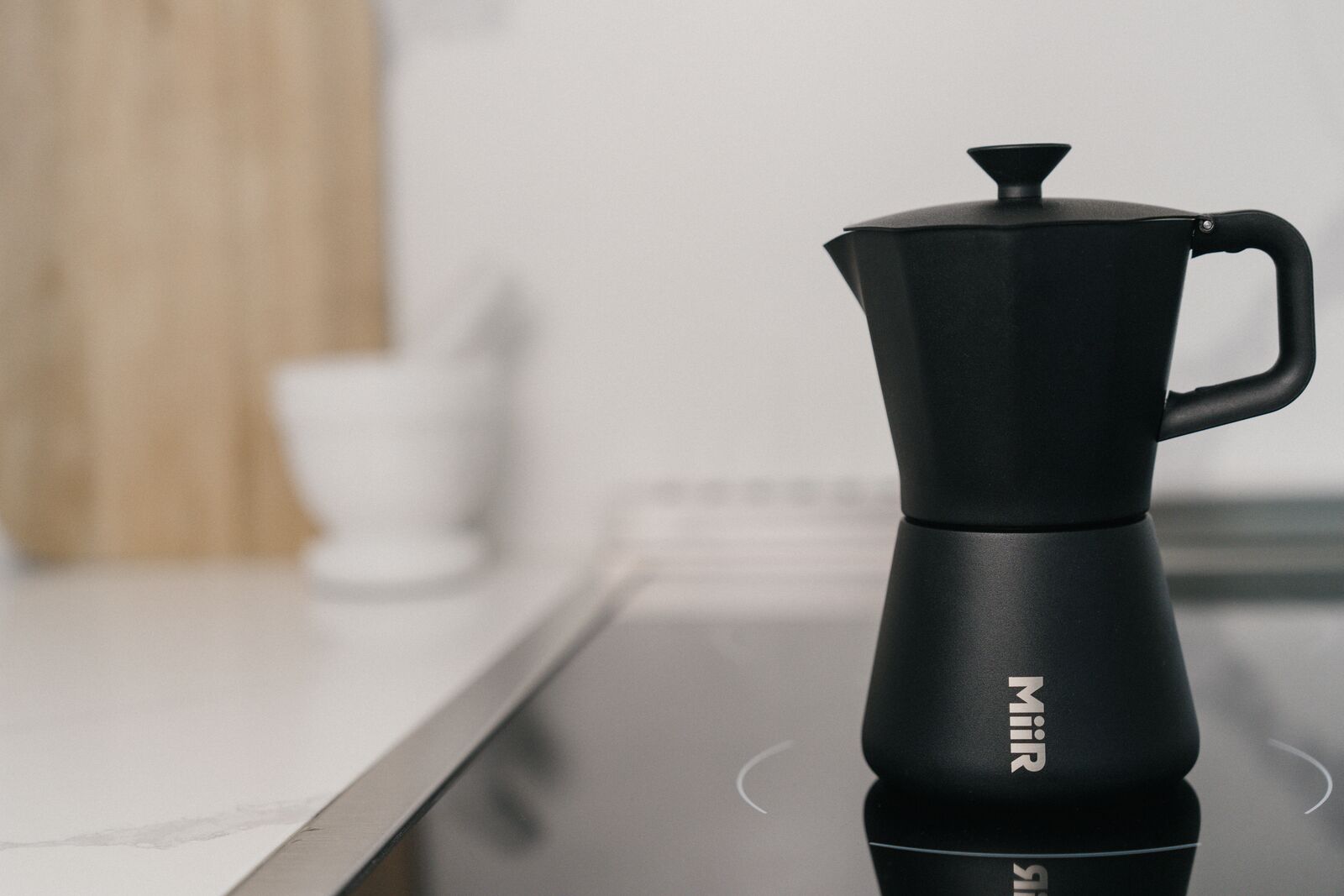 New Standard Moka Pot on glass stovetop.